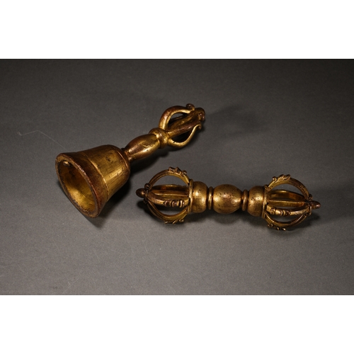 5 - A set of bronze gilt ritual implementsthe larger one 11.5cm long