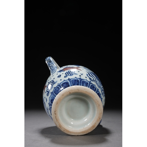 50 - A blue and white underglazed ewer 'fish and water plant' 17cm high, 16.5cm wide