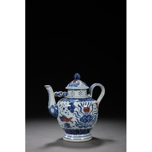 50 - A blue and white underglazed ewer 'fish and water plant' 17cm high, 16.5cm wide