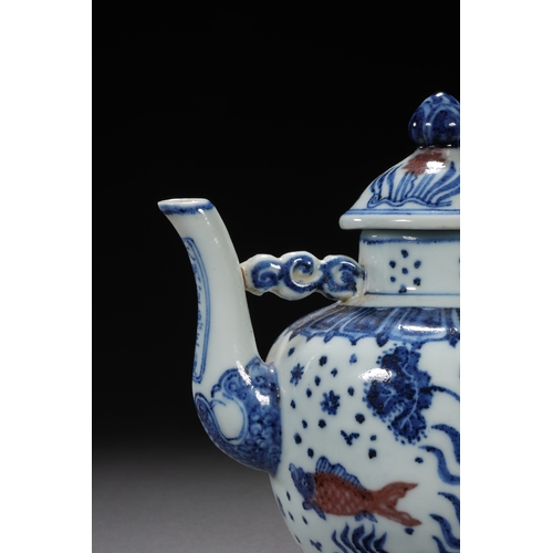 50 - A blue and white underglazed ewer 'fish and water plant' 17cm high, 16.5cm wide