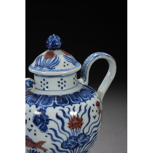 50 - A blue and white underglazed ewer 'fish and water plant' 17cm high, 16.5cm wide