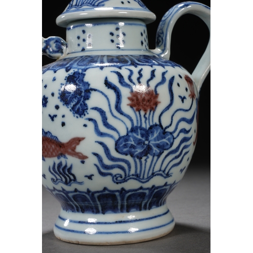 50 - A blue and white underglazed ewer 'fish and water plant' 17cm high, 16.5cm wide