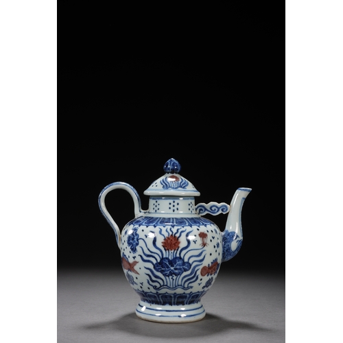 50 - A blue and white underglazed ewer 'fish and water plant' 17cm high, 16.5cm wide