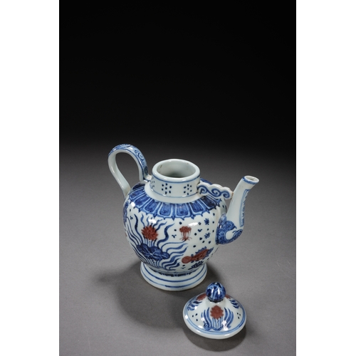 50 - A blue and white underglazed ewer 'fish and water plant' 17cm high, 16.5cm wide