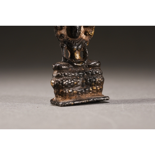 52 - A Nepalese-style bronze figure of seated Buddha, Qing Dynasty 6.3cm high