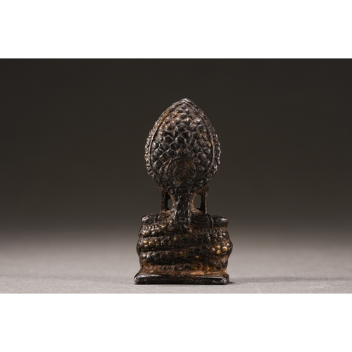 52 - A Nepalese-style bronze figure of seated Buddha, Qing Dynasty 6.3cm high