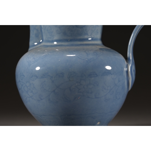 53 - A blue glazed floral ewer with lid 14.5cm high