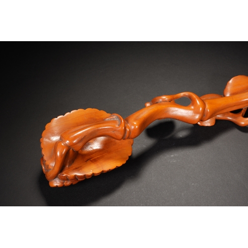 62 - A boxwood ruyi sceptre, Qing Dynasty 31.5cm long