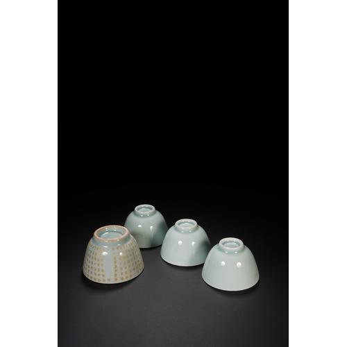 68 - A group of four celadon glazed tea cups the largest one 7.5cm diameter, 5cm high