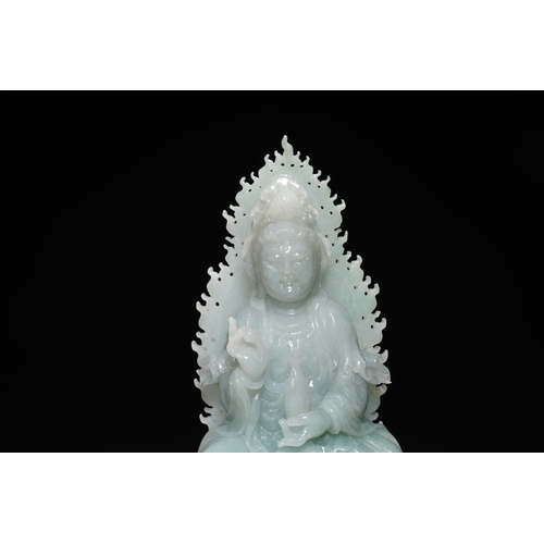 76 - A jadeite seated Guanyin, Qing Dynasty 16.5cm high, 7.5cm wide