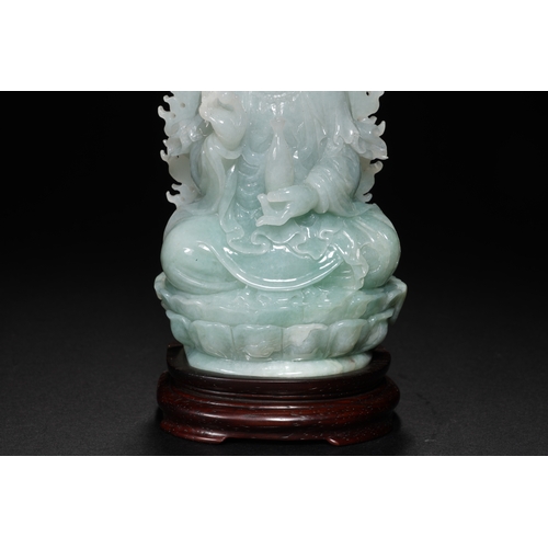 76 - A jadeite seated Guanyin, Qing Dynasty 16.5cm high, 7.5cm wide