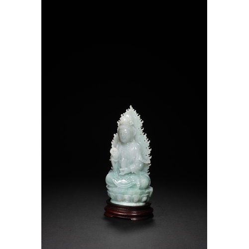 76 - A jadeite seated Guanyin, Qing Dynasty 16.5cm high, 7.5cm wide