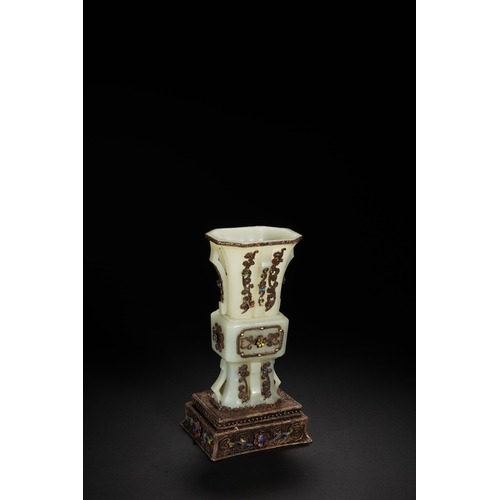 80 - A white jade with silver inlay and gilt flower gu-form vase, Qing Dynasty 21cm high, 11.5cm wid... 