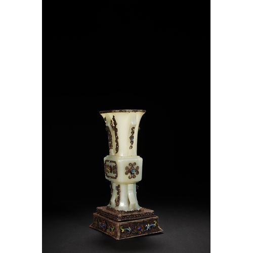 80 - A white jade with silver inlay and gilt flower gu-form vase, Qing Dynasty 21cm high, 11.5cm wid... 