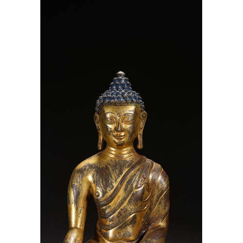 81 - A gilt bronze seated statue of Shakyamuni Buddha, Qing Dynasty 25cm high, 18cm wide