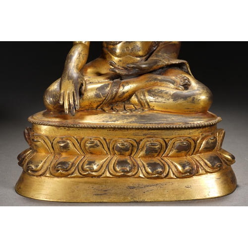 81 - A gilt bronze seated statue of Shakyamuni Buddha, Qing Dynasty 25cm high, 18cm wide