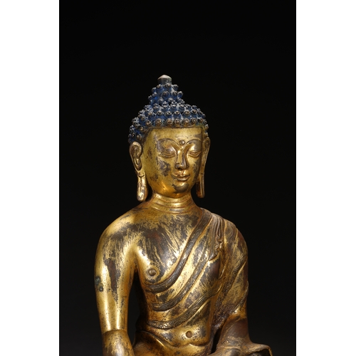 81 - A gilt bronze seated statue of Shakyamuni Buddha, Qing Dynasty 25cm high, 18cm wide