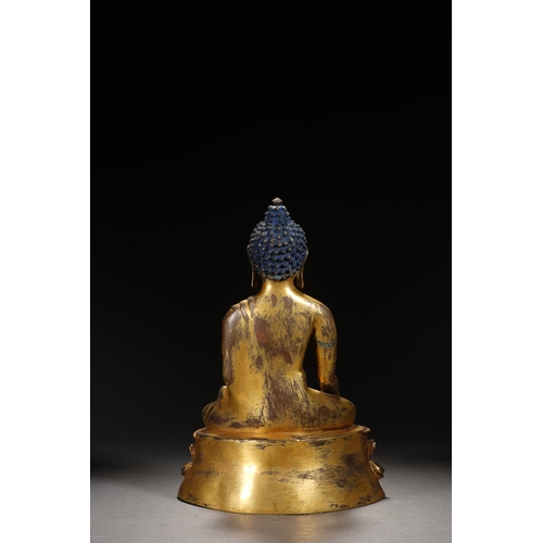 81 - A gilt bronze seated statue of Shakyamuni Buddha, Qing Dynasty 25cm high, 18cm wide