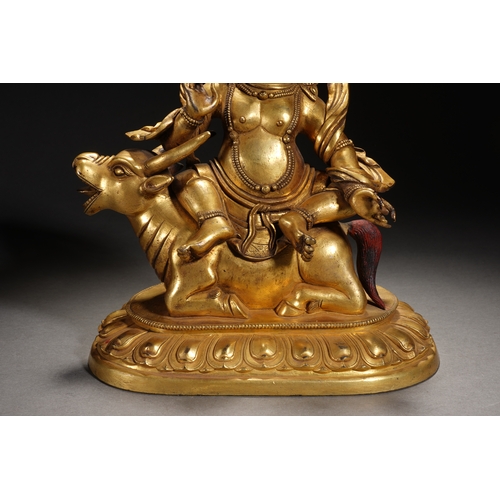 84 - A gilt bronze seated statue of Mahakala, Qing Dynasty 23cm high, 19cm wide