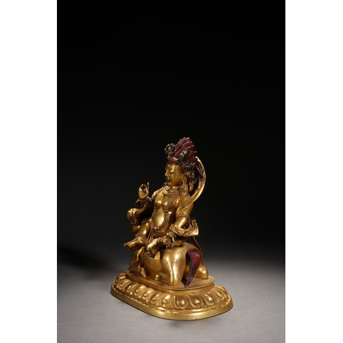 84 - A gilt bronze seated statue of Mahakala, Qing Dynasty 23cm high, 19cm wide