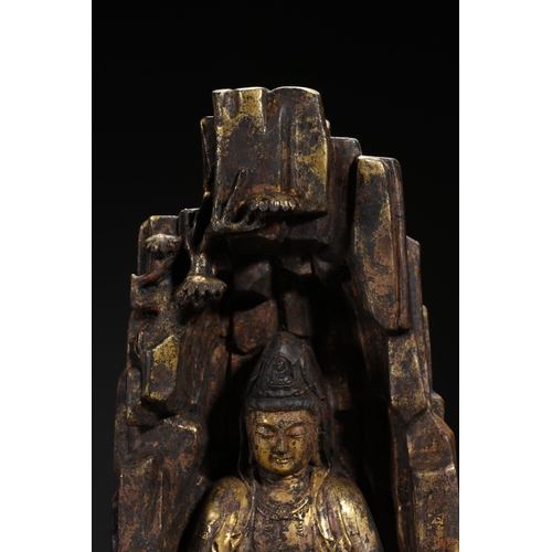 85 - A gilt bronze seated statue of Guanyin, Qing Dynasty 22.5cm high, 12.5cm wide