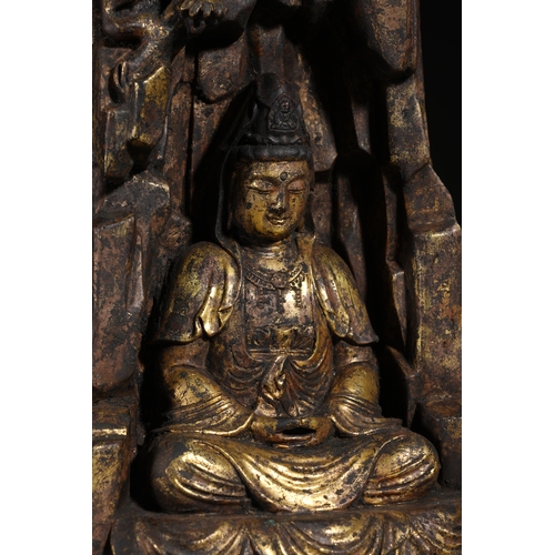 85 - A gilt bronze seated statue of Guanyin, Qing Dynasty 22.5cm high, 12.5cm wide