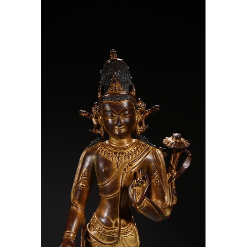 86 - A Nepalese-style bronze and gold lacquer standing Guanyin, Qing Dynasty 35.5cm high, 12cm wide... 