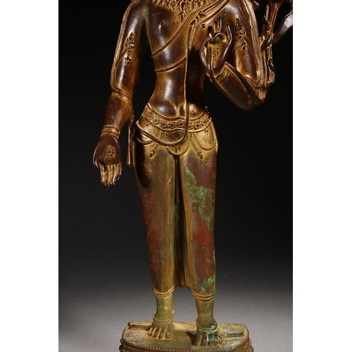 86 - A Nepalese-style bronze and gold lacquer standing Guanyin, Qing Dynasty 35.5cm high, 12cm wide... 