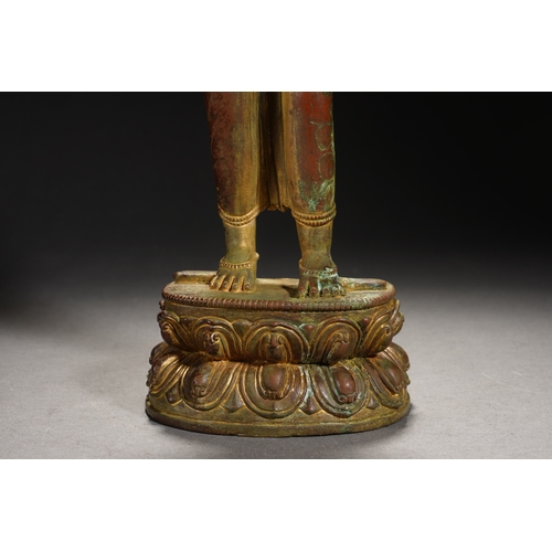 86 - A Nepalese-style bronze and gold lacquer standing Guanyin, Qing Dynasty 35.5cm high, 12cm wide... 