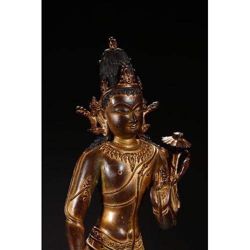 86 - A Nepalese-style bronze and gold lacquer standing Guanyin, Qing Dynasty 35.5cm high, 12cm wide... 