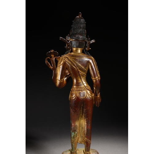 86 - A Nepalese-style bronze and gold lacquer standing Guanyin, Qing Dynasty 35.5cm high, 12cm wide... 