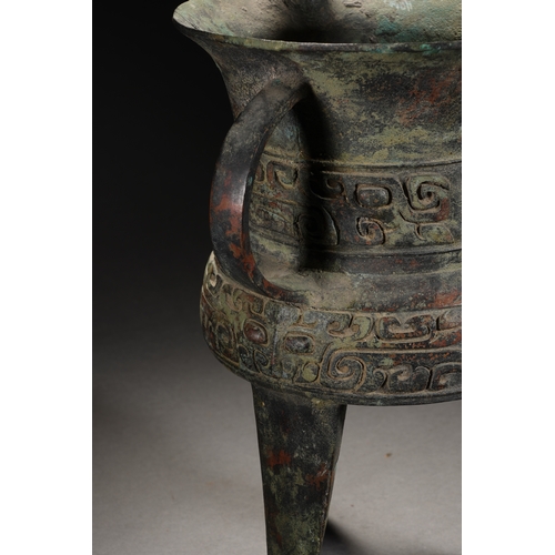 87 - A bronze vessel 28cm high, 15cm wide