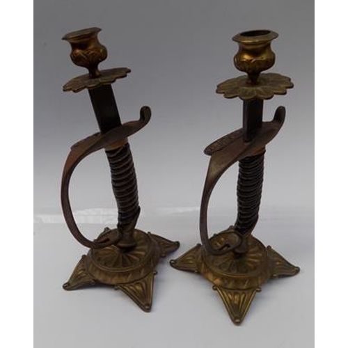 16 - Pair of converted sword handled candlesticks