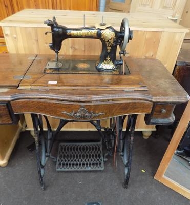 jones sewing machine in cabinet