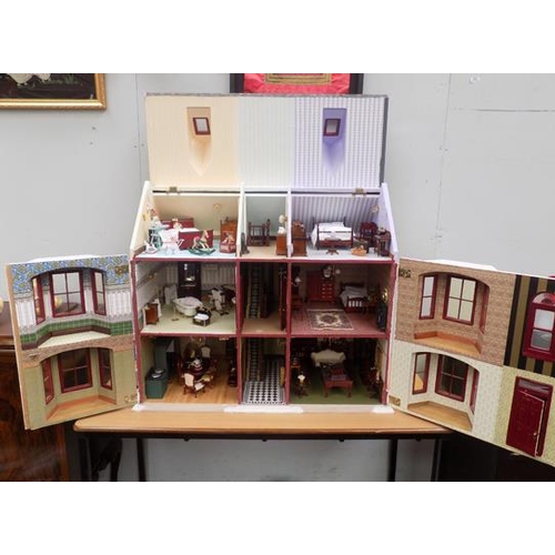 550a - Beautifully furnished large dolls house with large selection of furniture etc.