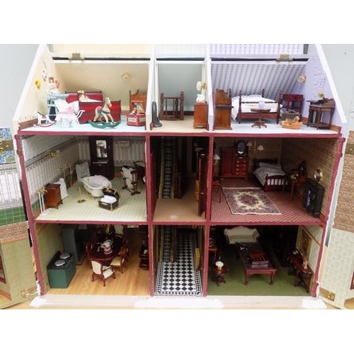 550a - Beautifully furnished large dolls house with large selection of furniture etc.