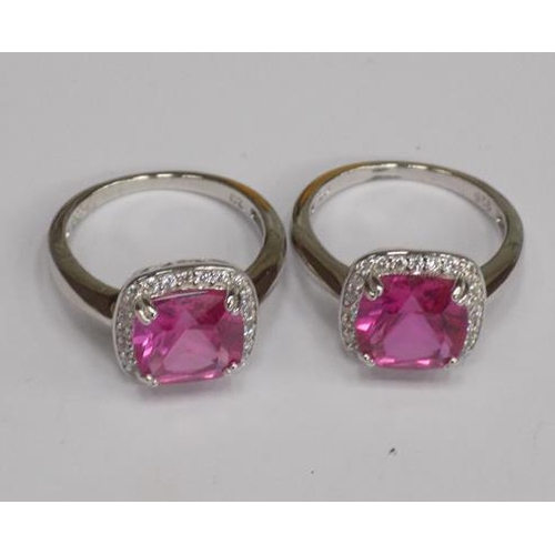 108 - Two silver rings with large pink stones