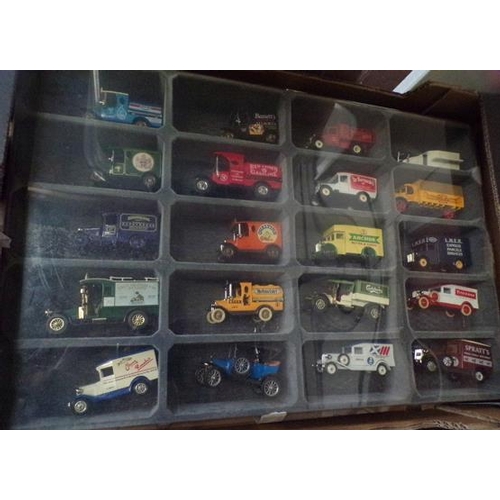 38 - Collection of vintage diecast advertising vans in display case