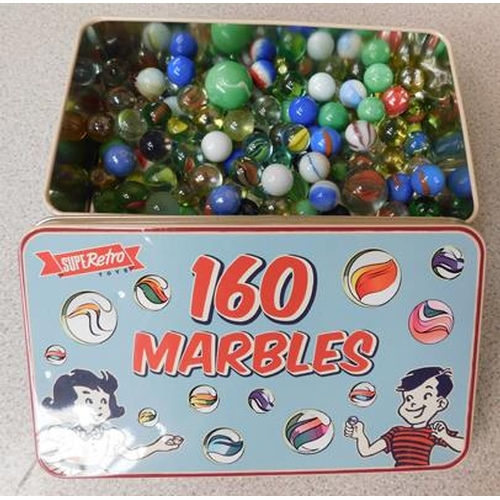 68 - Tin of marbles