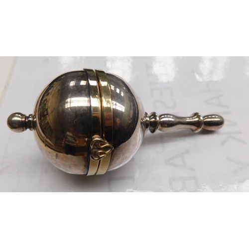 98 - White metal baby rattle, opens to reveal £5 coin & mirror
