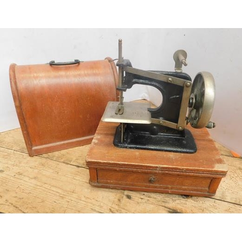 265 - Vintage miniature sewing machine in wooden box with drawer