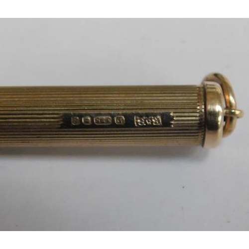 245 - 9ct Gold propelling toothpick