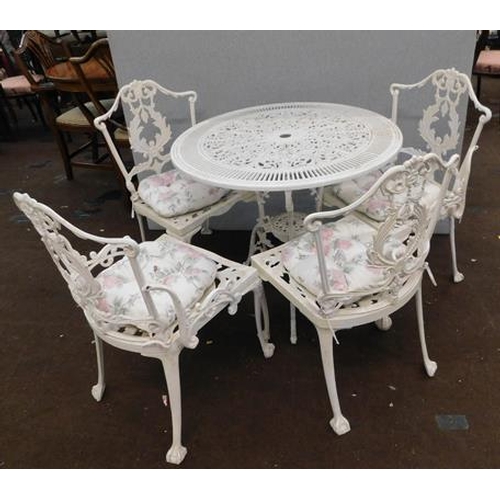 529 - Cast bistro table and four chairs