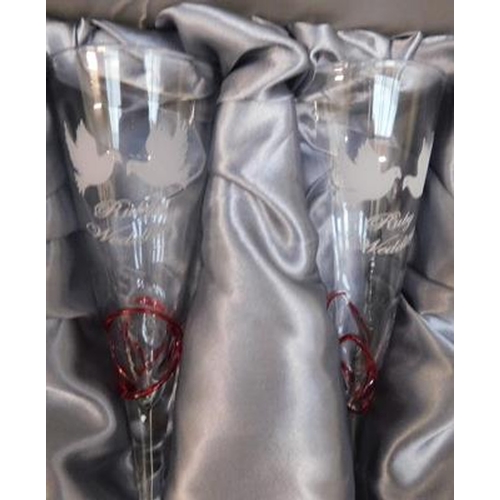 623 - Pair of boxed ruby anniversary glasses & two decanters