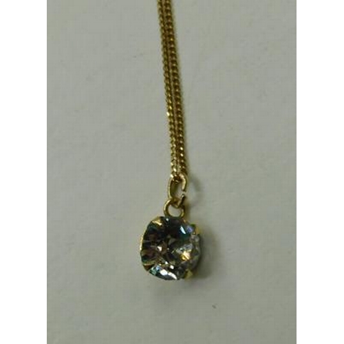 119 - 9ct Gold chain & solitaire pendant