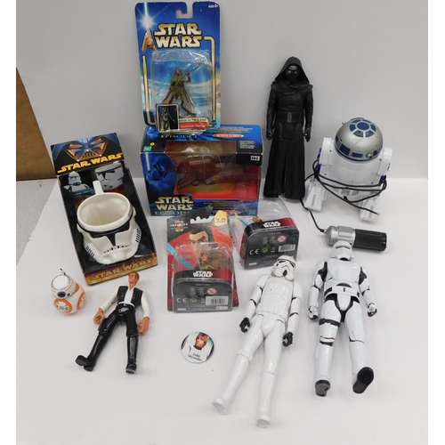 199 - Collectable quantity of Star Wars memorabilia, figures. cups, battery operated R2D2 etc