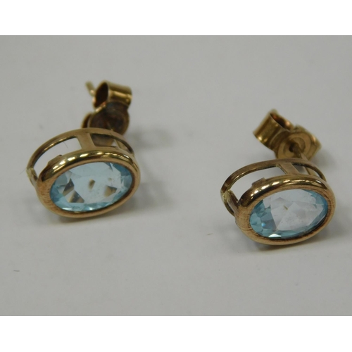 204 - 9ct Gold blue topaz earrings