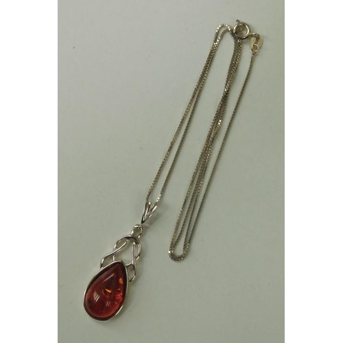 213 - Silver & amber Celtic pendant on silver chain