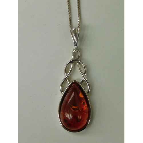 213 - Silver & amber Celtic pendant on silver chain