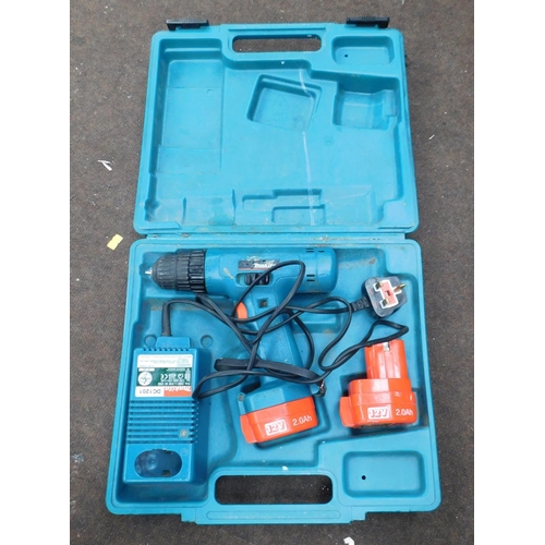 502 - Makita drill and 2x batteries W/O